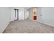 Bright, carpeted bedroom with a view of the bathroom and multiple closets at 2752 Drummossie Dr, Henderson, NV 89044