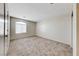 Neutral bedroom featuring carpeted floors, a window with blinds, and fresh neutral paint at 2752 Drummossie Dr, Henderson, NV 89044