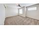 Spacious bedroom with carpet floors, ceiling fan, and windows with blinds at 2752 Drummossie Dr, Henderson, NV 89044