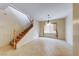 Dining area with staircase, tile flooring, and a hanging light fixture at 2752 Drummossie Dr, Henderson, NV 89044