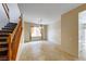 Dining area featuring tile flooring, a hanging light fixture, and staircase at 2752 Drummossie Dr, Henderson, NV 89044