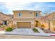 Charming two-story home featuring a front yard with minimalist landscaping and a two-car garage at 2752 Drummossie Dr, Henderson, NV 89044
