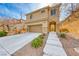 Charming two-story home featuring a front yard with minimalist landscaping and a two-car garage at 2752 Drummossie Dr, Henderson, NV 89044