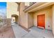 Welcoming entryway featuring a vibrant red front door and a covered walkway to the main entrance at 2752 Drummossie Dr, Henderson, NV 89044