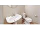Cozy half bath featuring pedestal sink and toilet at 2752 Drummossie Dr, Henderson, NV 89044