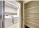Laundry room with washer, dryer, and shelving for storage at 2752 Drummossie Dr, Henderson, NV 89044