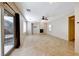 Spacious living room with tile flooring, a modern fireplace, and large windows for natural light at 2752 Drummossie Dr, Henderson, NV 89044
