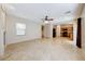 Open-concept living area with tile flooring, fireplace, and seamless transition to the kitchen at 2752 Drummossie Dr, Henderson, NV 89044