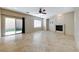 Bright living room with fireplace, sliding glass doors to the backyard, and neutral-toned walls at 2752 Drummossie Dr, Henderson, NV 89044