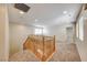 Open loft space with neutral carpet and paint and natural light from large windows at 2752 Drummossie Dr, Henderson, NV 89044