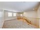 Bright, neutral-colored carpeted loft with staircase and lots of natural light at 2752 Drummossie Dr, Henderson, NV 89044