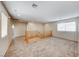 Neutral carpeted loft with staircase and great natural light from large windows at 2752 Drummossie Dr, Henderson, NV 89044