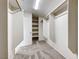 Spacious walk-in closet featuring built-in shelving and hanging rods for organized storage at 2752 Drummossie Dr, Henderson, NV 89044