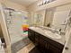 Bathroom features dual sinks, granite counters, a walk-in shower and modern fixtures at 2790 Chetco River St, Laughlin, NV 89029
