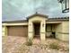 Beautiful single story home with a tan exterior, brown garage door, and brick paver landing at 2790 Chetco River St, Laughlin, NV 89029