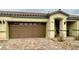 Lovely single story home featuring a two car garage, tan exterior, and brick paver landing at 2790 Chetco River St, Laughlin, NV 89029