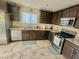 Charming kitchen featuring stainless steel appliances, granite countertops, and plenty of storage space at 2790 Chetco River St, Laughlin, NV 89029