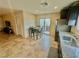 An eat-in kitchen featuring tile floors, a dining table, and stainless steel appliances at 2790 Chetco River St, Laughlin, NV 89029