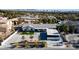 Aerial view of a house with desert landscaping, a large driveway, and mature trees at 2870 Belcastro St, Las Vegas, NV 89117