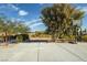 Open backyard with concrete and trees for shade, basketball hoop in back corner at 2870 Belcastro St, Las Vegas, NV 89117