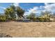 Large backyard featuring some trees in need of landscaping in a nice neighborhood at 2870 Belcastro St, Las Vegas, NV 89117