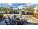 Backyard patio with a modern fire pit and matching outdoor chairs at 2870 Belcastro St, Las Vegas, NV 89117