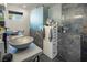 Stylish bathroom featuring dual vessel sinks, elegant marble accents, and modern vanity with ample storage space at 2870 Belcastro St, Las Vegas, NV 89117