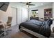 Well-lit bedroom with large closet, ceiling fan, and window providing natural light and comfortable living space at 2870 Belcastro St, Las Vegas, NV 89117