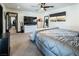 Spacious bedroom featuring an expansive bed, walk-in closet and a large entertainment center at 2870 Belcastro St, Las Vegas, NV 89117