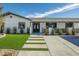 Close-up of modern walkway and manicured lawn leading to front door at 2870 Belcastro St, Las Vegas, NV 89117