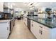 Updated kitchen boasts granite countertops, stainless steel appliances, and modern finishes at 2870 Belcastro St, Las Vegas, NV 89117