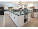 Bright kitchen featuring a large island, stainless appliances, and white cabinets at 2870 Belcastro St, Las Vegas, NV 89117