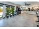 Bright and airy living space with sliding doors to the backyard and an open view of the kitchen at 2870 Belcastro St, Las Vegas, NV 89117