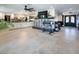 Spacious open floor plan with decorative fireplace seamlessly connecting the living and kitchen areas at 2870 Belcastro St, Las Vegas, NV 89117