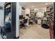 Spacious home office featuring built-in shelving, multiple desks, and comfortable seating perfect for productivity at 2870 Belcastro St, Las Vegas, NV 89117