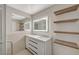 Bright bathroom featuring dual sinks, modern lighting, and an adjacent glass shower at 304 Orland St # 38, Las Vegas, NV 89107