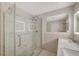 Luxurious bathroom featuring a glass-enclosed shower, dual sinks, and elegant marble accents at 304 Orland St # 38, Las Vegas, NV 89107