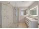 Stylish bathroom featuring a glass-enclosed shower, dual sinks, and modern finishes at 304 Orland St # 38, Las Vegas, NV 89107
