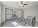 Neutral bedroom featuring soft carpet, a ceiling fan, and access to the closet at 304 Orland St # 38, Las Vegas, NV 89107