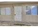 Apartment 38 entrance with security door, dual-pane windows, and neutral exterior at 304 Orland St # 38, Las Vegas, NV 89107