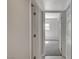 Neutral hallway offers a glimpse into a bedroom with soft, natural lighting at 304 Orland St # 38, Las Vegas, NV 89107