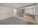 Spacious living room showcases neutral walls, carpet, and a view of the modern kitchen at 304 Orland St # 38, Las Vegas, NV 89107