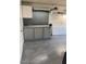 Clean garage with a glossy floor, metal pegboard, and built-in cabinets for storage and organization at 3417 Iberia St, Las Vegas, NV 89146