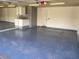 Spacious garage with a glossy floor, white cabinets, fluorescent lighting, and plenty of storage at 3417 Iberia St, Las Vegas, NV 89146