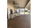 Covered patio with an outdoor kitchen, stainless grill, mini fridge, ceiling fans, and tile countertops at 3417 Iberia St, Las Vegas, NV 89146