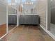 Contemporary bathroom featuring double vanities, slate tile floor and walk-in shower at 350 Loma Marsh Ct, North Las Vegas, NV 89084