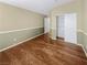 Bedroom with neutral tones and laminate flooring and closet at 350 Loma Marsh Ct, North Las Vegas, NV 89084