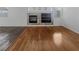 Spacious living room with wood floors and a tile fireplace that is ready to be decorated at 350 Loma Marsh Ct, North Las Vegas, NV 89084