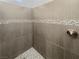 Modern bathroom shower with stylish tile and a rainfall shower head at 350 Loma Marsh Ct, North Las Vegas, NV 89084