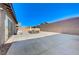 Backyard featuring a large patio, seating area, and privacy wall at 370 Mano Destra Ln, Henderson, NV 89011
